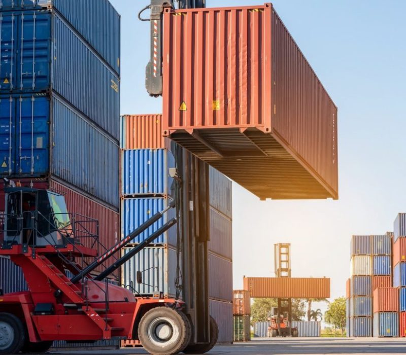 forklift-working-in-the-container-cargo-yard-port-loading-cargo-tank-logistic-service-and-transport-e1665466492906